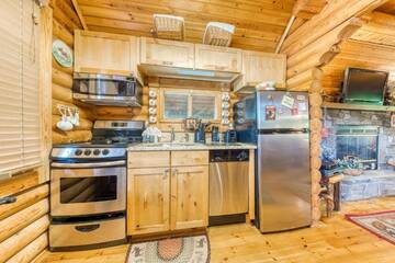 Open fully equipped kitchen in your rustic cabin.